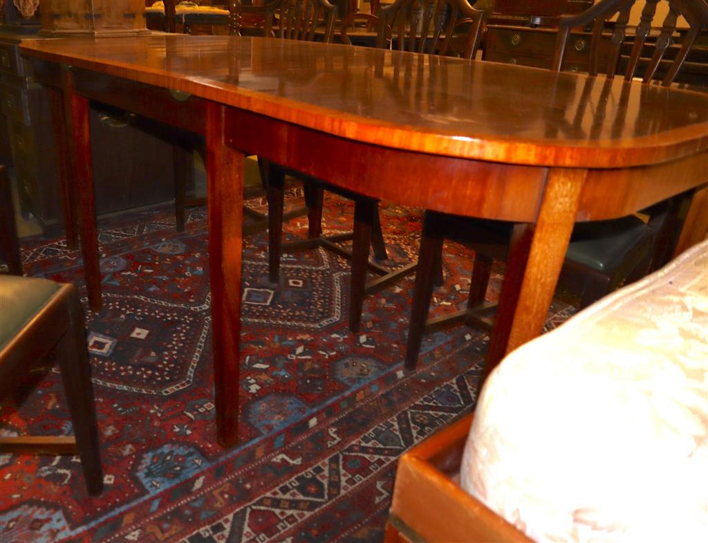 A Georgian style satinwood-banded mahogany D-end dining table with additional leaf, 195cm extended and a set of eight Hepplewhite style